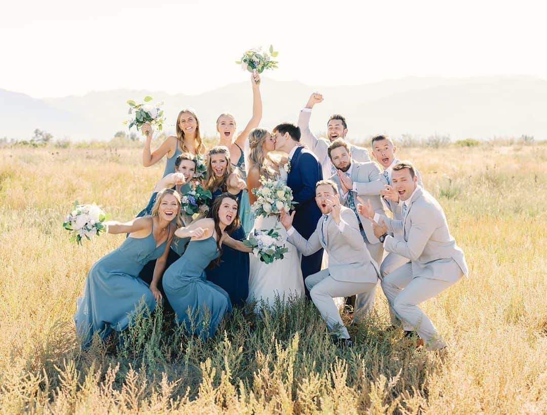 wedding party at creekside event center with the rocky mountains in the back